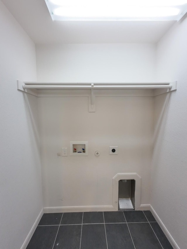 laundry area featuring hookup for a gas dryer, electric dryer hookup, dark tile patterned floors, and hookup for a washing machine