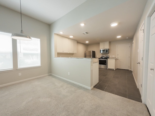 kitchen featuring stainless steel appliances, white cabinetry, dark colored carpet, recessed lighting, and baseboards