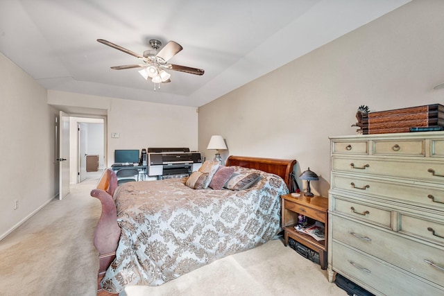 bedroom featuring light carpet, a ceiling fan, and baseboards