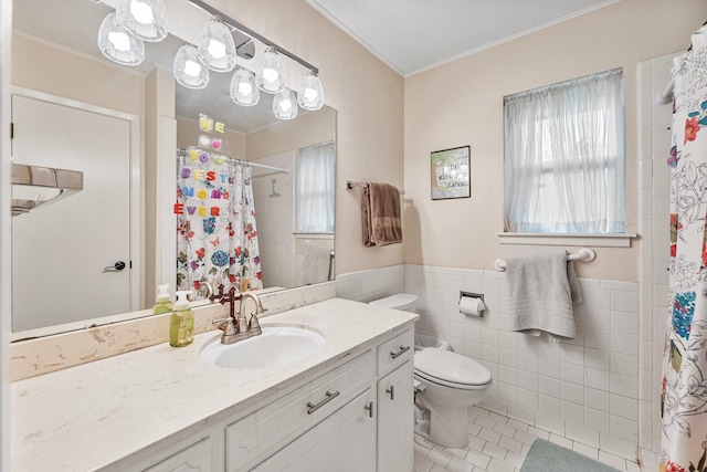 full bathroom featuring tile patterned floors, toilet, tile walls, plenty of natural light, and ornamental molding