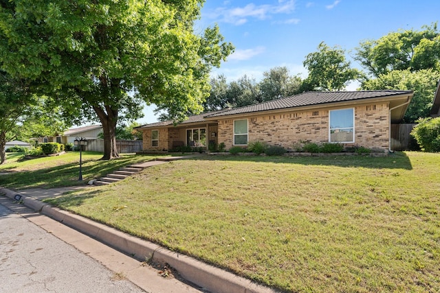 single story home featuring brick siding