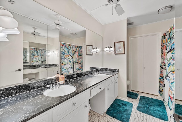 bathroom with ceiling fan, tile patterned flooring, toilet, and double vanity