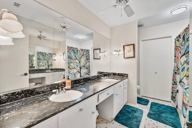 full bath featuring a ceiling fan, double vanity, toilet, and tile patterned floors