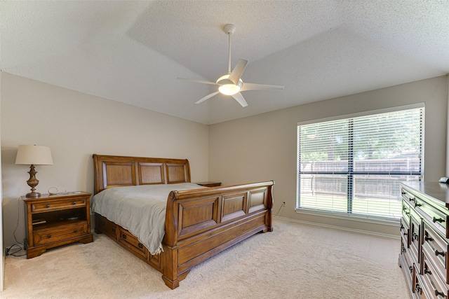 3817 Roman Ct, Plano, TX 75023 - bedroom with light colored carpet, vaulted ceiling, a textured ceiling, a ceiling fan, and baseboards