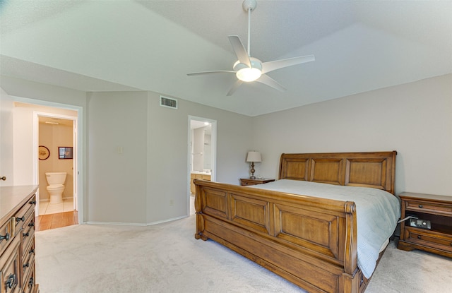 3817 Roman Ct, Plano, TX 75023 - bedroom featuring light carpet, ensuite bath, baseboards, and a ceiling fan