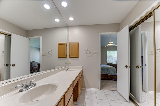3817 Roman Ct, Plano, TX 75023 - ensuite bathroom featuring recessed lighting, tile patterned flooring, double vanity, and baseboards