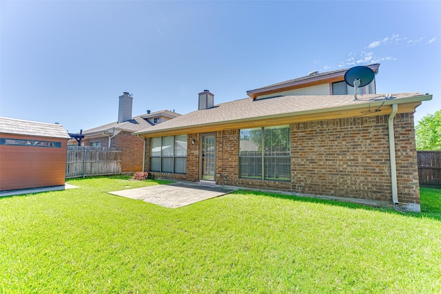 3817 Roman Ct, Plano, TX 75023 - back of property with brick siding, a patio area, and a chimney