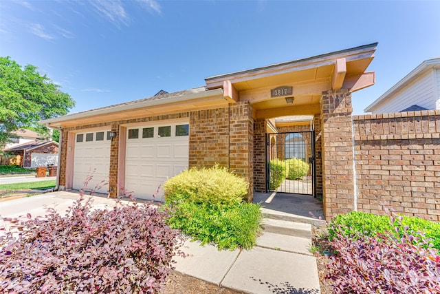 3817 Roman Ct, Plano, TX 75023 - view of front of house with concrete driveway, a garage, and brick siding