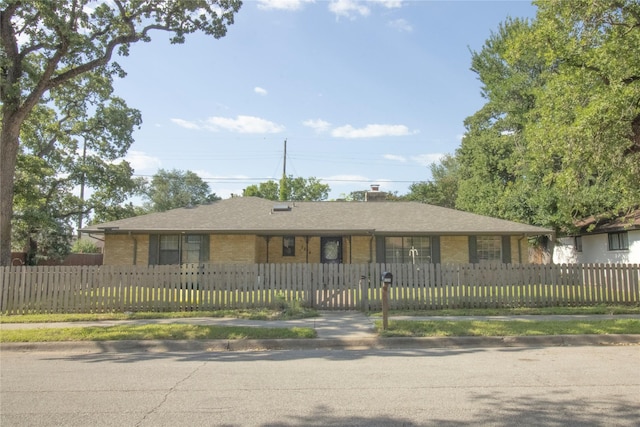 1524 Daywood Ln, Irving, TX 75061 - ranch-style house featuring brick siding, a fenced front yard, and a chimney