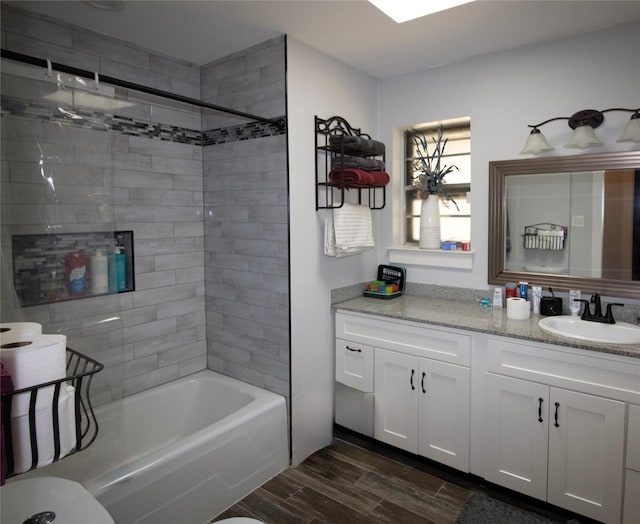 1524 Daywood Ln, Irving, TX 75061 - bathroom with wood finished floors, shower / bathtub combination, and vanity