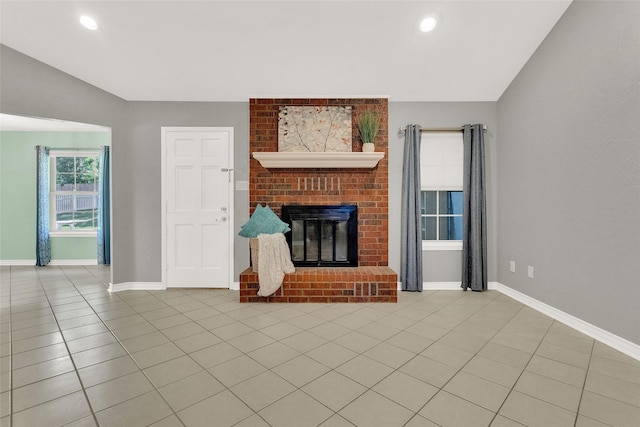 8811 Pheasant Dr, Chandler, TX 75758 - unfurnished living room featuring light tile patterned floors, baseboards, a brick fireplace, lofted ceiling, and recessed lighting