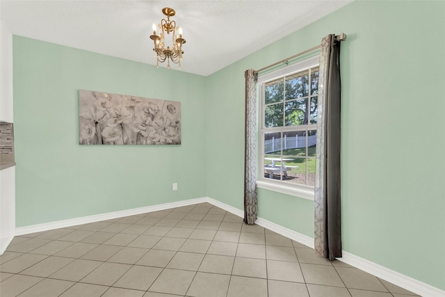 8811 Pheasant Dr, Chandler, TX 75758 - empty room featuring a chandelier, baseboards, and a textured ceiling