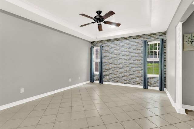 8811 Pheasant Dr, Chandler, TX 75758 - unfurnished room with a raised ceiling, a ceiling fan, baseboards, and light tile patterned floors