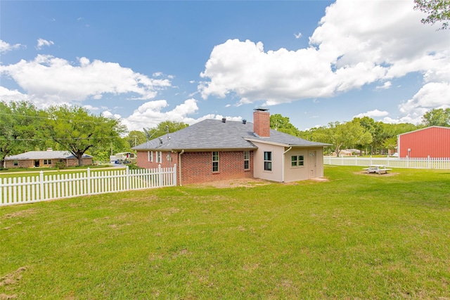 8811 Pheasant Dr, Chandler, TX 75758 - back of house with a chimney and brick siding