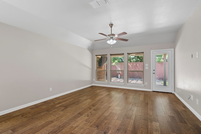 409 Bird Creek Dr, Little Elm, TX 75068 - empty room with wood finished floors, ceiling fan, baseboards, and lofted ceiling