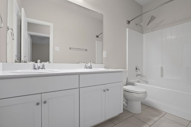 409 Bird Creek Dr, Little Elm, TX 75068 - full bathroom featuring toilet, bathing tub / shower combination, double vanity, and tile patterned floors