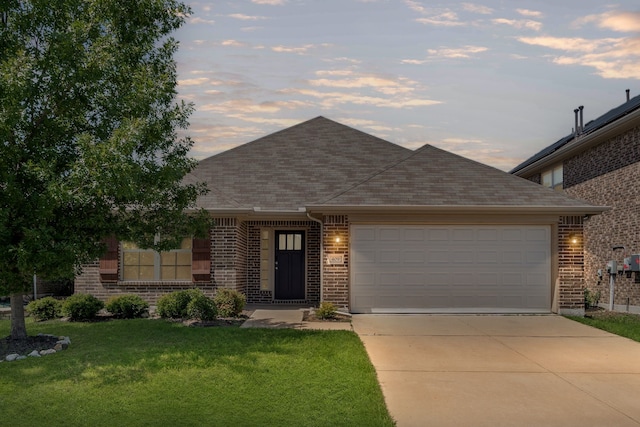 409 Bird Creek Dr, Little Elm, TX 75068 - view of front of property featuring brick siding, a front yard, a garage, and driveway
