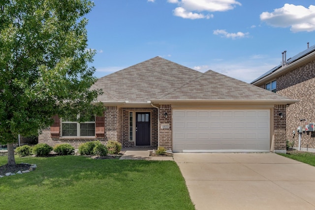 409 Bird Creek Dr, Little Elm, TX 75068 - view of front facade with brick siding, a front yard, a shingled roof, an attached garage, and concrete driveway