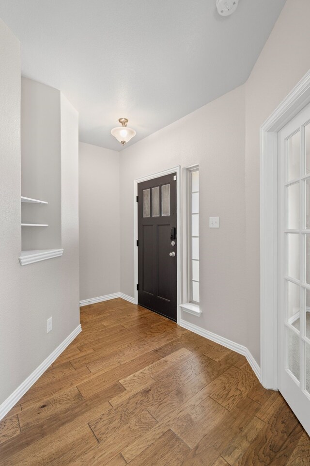 409 Bird Creek Dr, Little Elm, TX 75068 - entrance foyer with wood finished floors and baseboards
