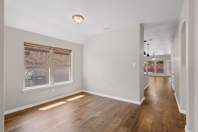 409 Bird Creek Dr, Little Elm, TX 75068 - spare room featuring wood finished floors, baseboards, and vaulted ceiling