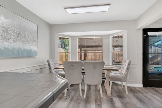 7108 Bermuda Ct, North Richland Hills, TX 76180 - dining space with wood finished floors and healthy amount of natural light
