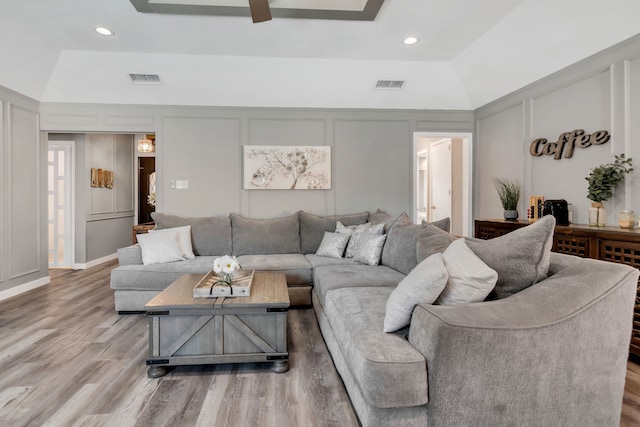 7108 Bermuda Ct, North Richland Hills, TX 76180 - living room with a decorative wall, light wood finished floors, a ceiling fan, and recessed lighting