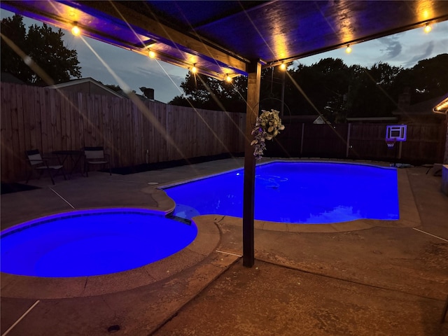 7108 Bermuda Ct, North Richland Hills, TX 76180 - pool at twilight featuring a fenced backyard and a patio