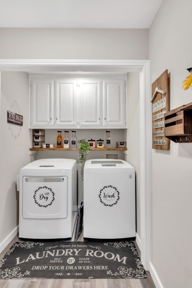 7108 Bermuda Ct, North Richland Hills, TX 76180 - laundry area with washer and dryer, cabinet space, baseboards, and wood finished floors