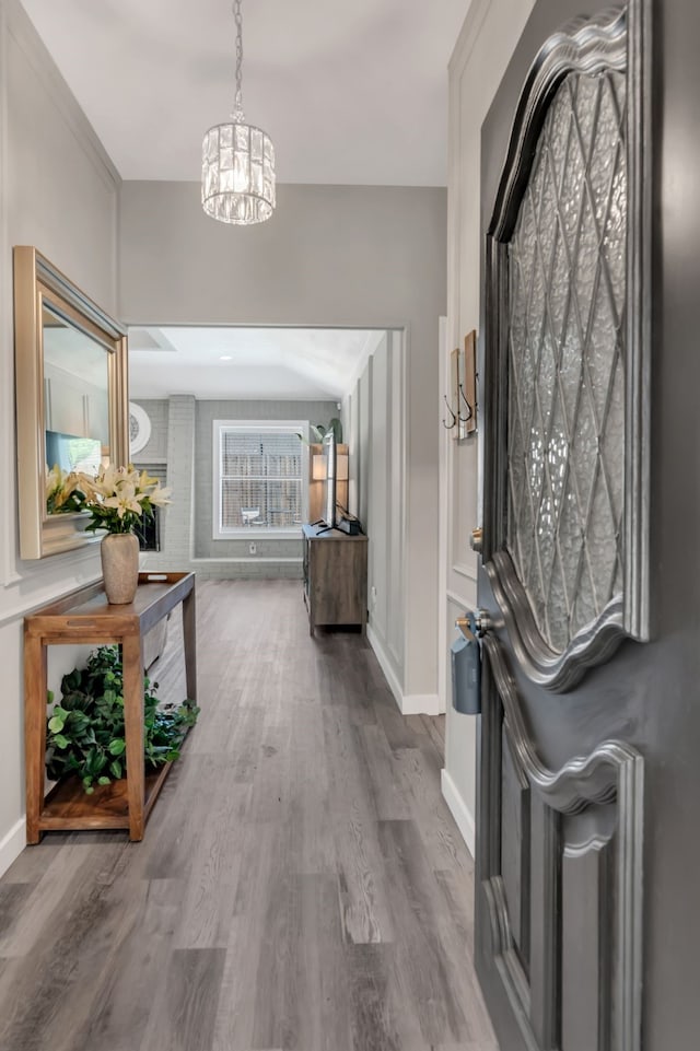 7108 Bermuda Ct, North Richland Hills, TX 76180 - entryway featuring a chandelier, wood finished floors, and baseboards