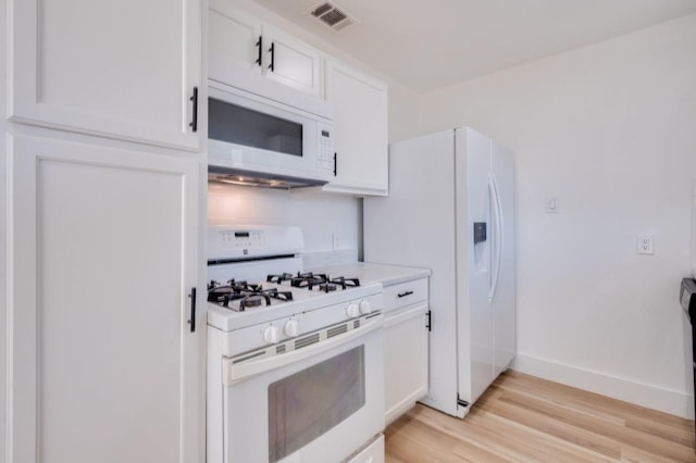 1902 San Antonio St, Grand Prairie, TX 75051 - kitchen featuring white appliances, light wood finished floors, white cabinetry, light countertops, and baseboards
