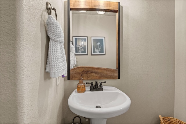 1704 Landon Ln, Mckinney, TX 75071 - bathroom with a textured wall and a sink