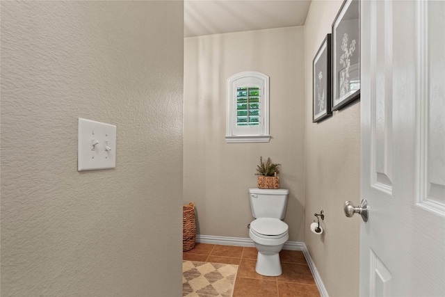 1704 Landon Ln, Mckinney, TX 75071 - bathroom featuring toilet, tile patterned flooring, and baseboards