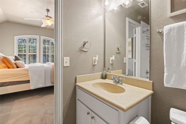 1704 Landon Ln, Mckinney, TX 75071 - ensuite bathroom featuring lofted ceiling, ceiling fan, vanity, toilet, and a textured wall