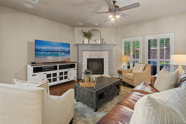 1704 Landon Ln, Mckinney, TX 75071 - living room with wood finished floors, ceiling fan, and a fireplace with raised hearth