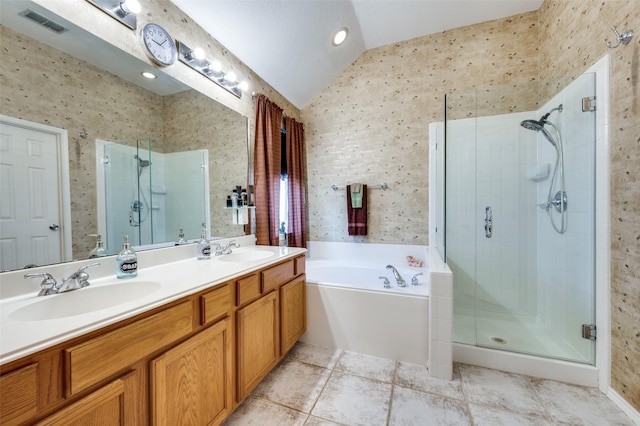 1699 Garrison Dr, Frisco, TX 75033 - full bathroom featuring vaulted ceiling, a shower stall, a bath, double vanity, and wallpapered walls