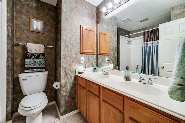 1699 Garrison Dr, Frisco, TX 75033 - bathroom featuring toilet, a shower with shower curtain, double vanity, wallpapered walls, and tile patterned floors
