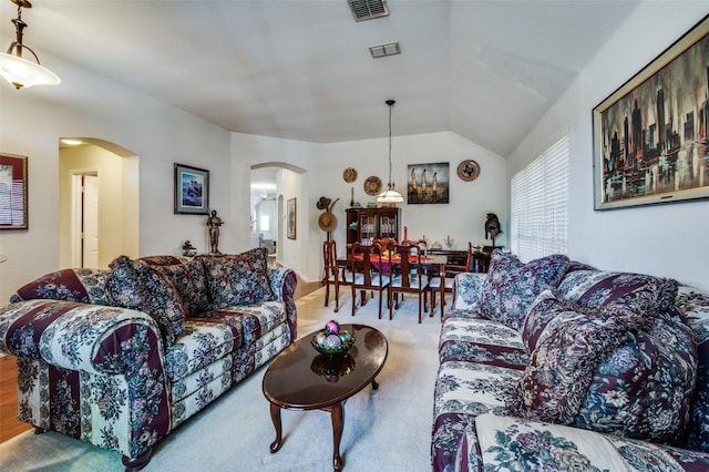 1699 Garrison Dr, Frisco, TX 75033 - carpeted living area featuring arched walkways and vaulted ceiling