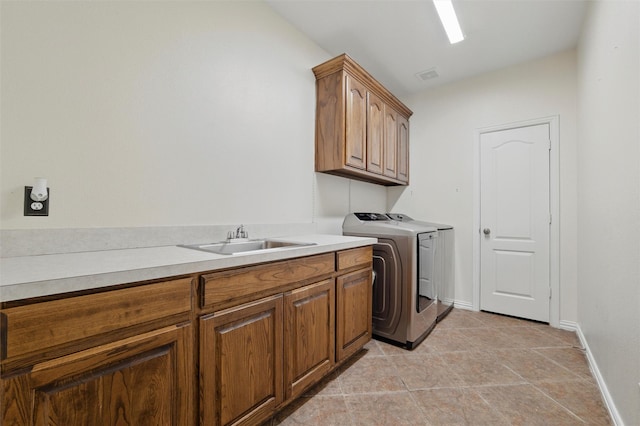 811 Shady Bend Dr, Kennedale, TX 76060 - laundry room with cabinet space, independent washer and dryer, baseboards, and light tile patterned floors