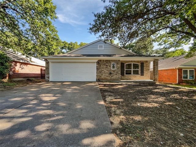 5205 Foley Dr, Arlington, TX 76013 - view of front of home featuring brick siding, concrete driveway, and an attached garage