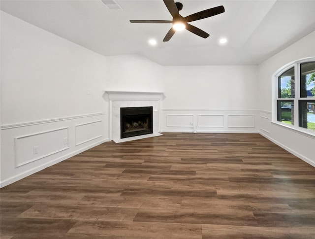 5205 Foley Dr, Arlington, TX 76013 - unfurnished living room with a ceiling fan, a premium fireplace, a decorative wall, recessed lighting, and wainscoting