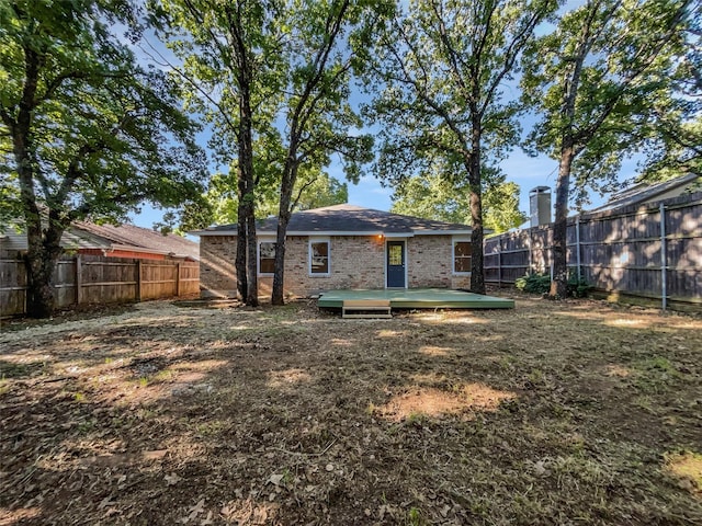 5205 Foley Dr, Arlington, TX 76013 - back of property featuring brick siding and a fenced backyard