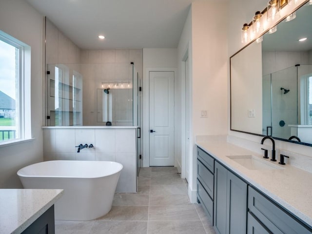 1045 Bent Tree Ln, Gunter, TX 75058 - full bath featuring a stall shower, vanity, a freestanding bath, and recessed lighting