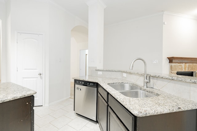 127 Wandering Dr, Forney, TX 75126 - kitchen featuring stainless steel dishwasher, a sink, arched walkways, ornamental molding, and light tile patterned floors