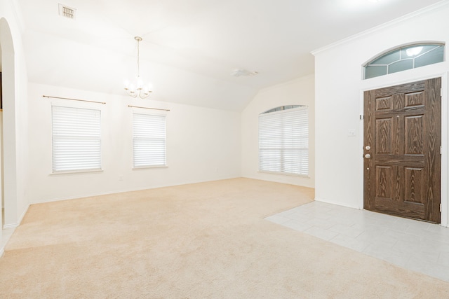 127 Wandering Dr, Forney, TX 75126 - carpeted foyer entrance featuring arched walkways, a chandelier, ornamental molding, lofted ceiling, and baseboards