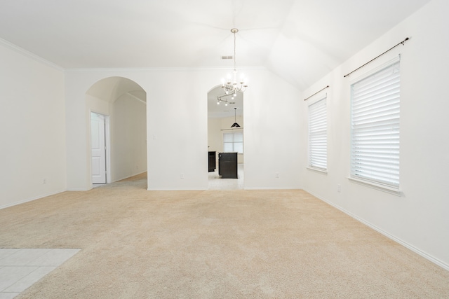 127 Wandering Dr, Forney, TX 75126 - empty room with arched walkways, light carpet, ornamental molding, baseboards, and vaulted ceiling