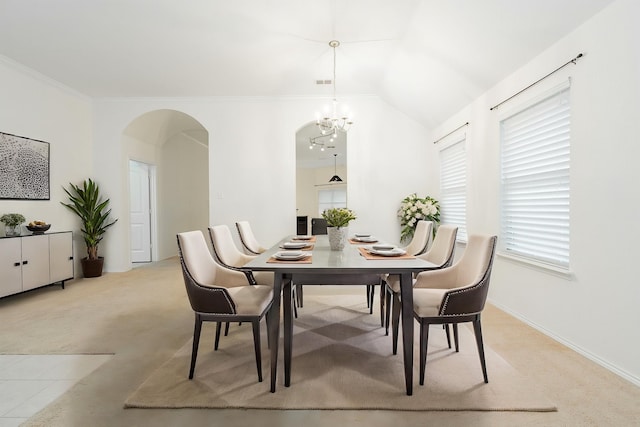 127 Wandering Dr, Forney, TX 75126 - dining room featuring arched walkways, light carpet, crown molding, a chandelier, and baseboards