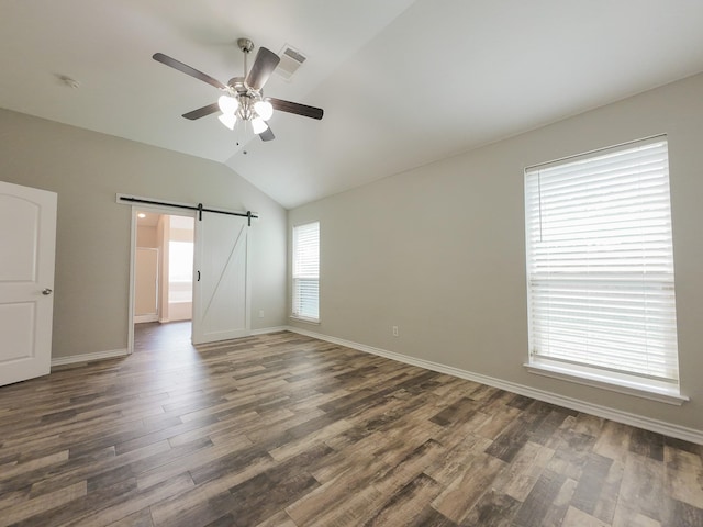 204 Spring Hollow Dr, Saginaw, TX 76131 - unfurnished room featuring lofted ceiling, a barn door, a ceiling fan, wood finished floors, and baseboards
