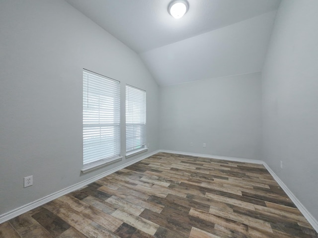204 Spring Hollow Dr, Saginaw, TX 76131 - spare room with lofted ceiling, wood finished floors, and baseboards