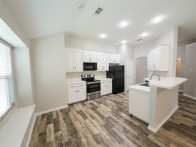 204 Spring Hollow Dr, Saginaw, TX 76131 - kitchen with black appliances, a sink, wood finished floors, white cabinets, and recessed lighting