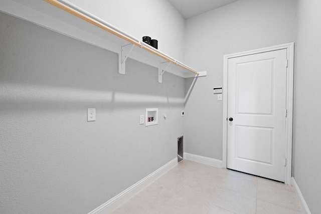 1038 Mickelson Dr, Granbury, TX 76048 - laundry area featuring washer hookup, hookup for a gas dryer, baseboards, hookup for an electric dryer, and light tile patterned flooring